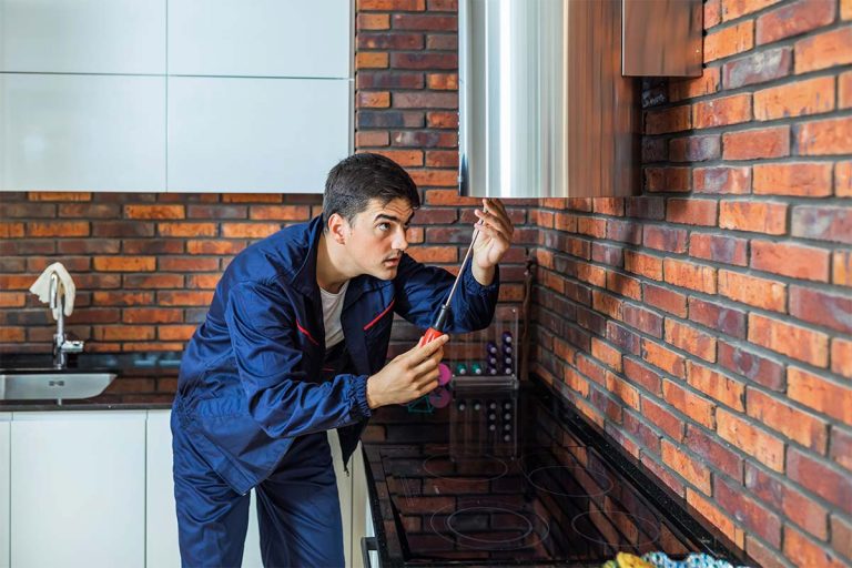 An air duct cleaner cleaning ductwork.