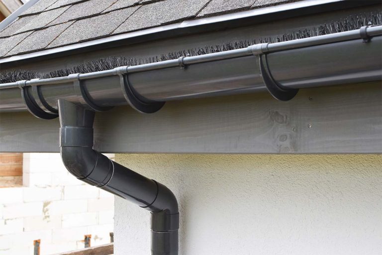 A black gutter guard on a house.